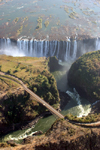 Victoria Falls - Mosi-oa-tunya, Matabeleland North province, Zimbabwe: the falls and the Zambesi bridge from the air - photo by R.Eime